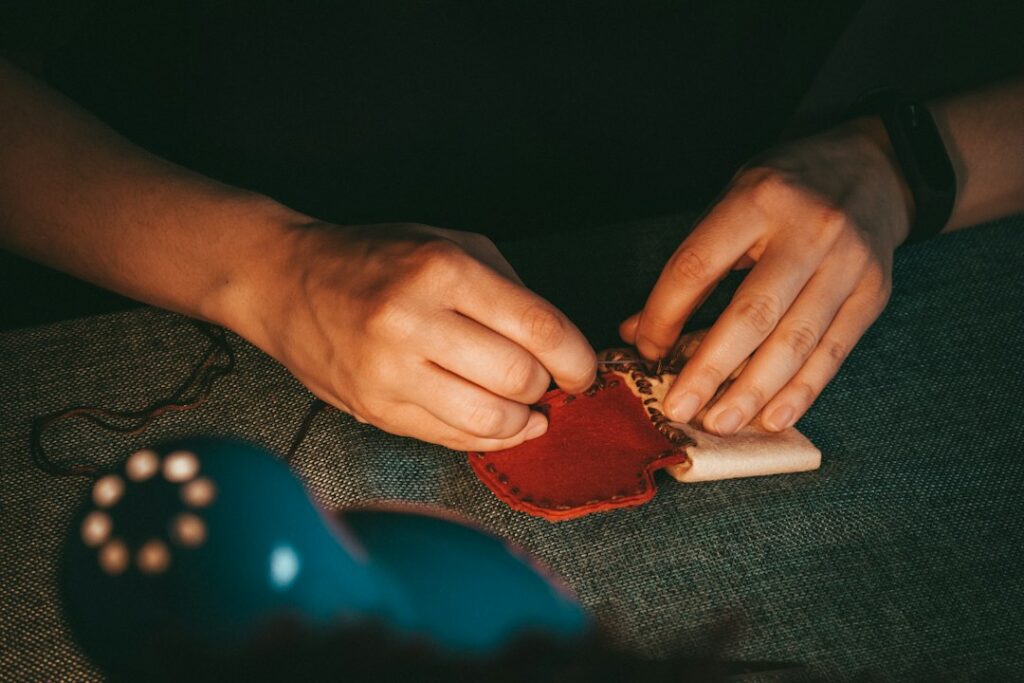 Hand holding a soft leather pouch